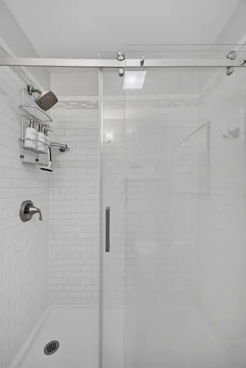 Tiled walk-in shower in the primary bath